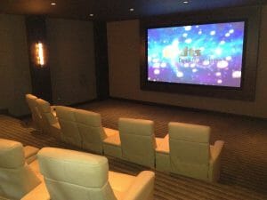 projector screen playing a move in someone's new home theater in utah