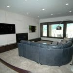 family room with entertainment system installed by reeds built in