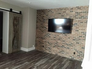 Wall Mounted TV against Brick