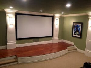 custom made home movie theater with wood step up