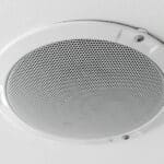 In-ceiling speaker installed as part of a whole home audio system