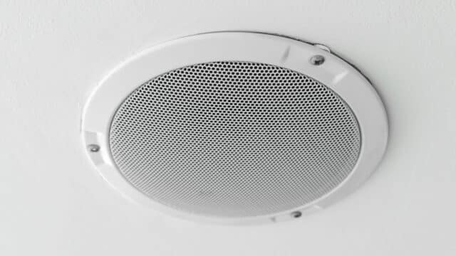 In-ceiling speaker installed as part of a whole home audio system