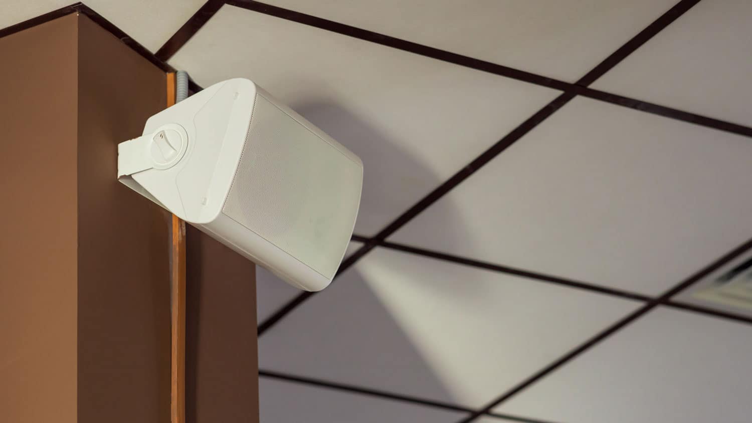 Wall-mounted speaker installed for a multiroom whole home audio system